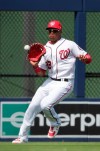 FILE - In this March 5, 2019, file photo, Washington Nationals outfielder Juan Soto (22) fields the ball in the fourth inning of an exhibition spring training baseball game against the Boston Red Sox in West Palm Beach, Fla. Soto, last season's surprise runner-up as NL Rookie of the Year at age 19, has a big hole to fill in the Nationals' lineup with Bryce Harper gone. (AP Photo/Brynn Anderson, File)