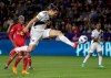 FILE - In this April 28, 2018, file photo, LA Galaxy forward Zlatan Ibrahimovic kicks the ball into the goal during the second half of an MLS soccer match against the New York Red Bulls, in Carson, Calif. The 37-year-old Ibrahimovic is returning to the Galaxy for a second season despite gathering interest from European clubs. The Swedish superstar was disappointed in the Galaxy‚Äôs overall performance last year despite his own strong debut in Major League Soccer. (AP Photo/Chris Carlson, File)