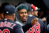 FILE - In this Monday, March 11, 2019, file photo, injured Cleveland Indians shortstop Francisco Lindor talks to a teammate in the dugout during the fourth inning of a spring training baseball game against the Cincinnati Reds in Goodyear, Ariz. Lindor will take a major step in his recovery from a calf strain by playing in a controlled minor league game. (AP Photo/Ross D. Franklin, File)