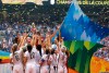 FILE - In this July 5, 2015 file photo, confetti floats down as the United States women's national team celebrate with the trophy after beating Japan 5-2 in the FIFA Women's World Cup soccer championship in Vancouver, British Columbia, Canada. When FIFA released its global strategy for women’s soccer last year, it was met by some skepticism. But soccer’s governing body is making some strides in implementing the long-range plan, against a backdrop of this summer’s World Cup in France. (AP Photo/Elaine Thompson, File)