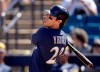 FILE - In this Sunday, March 3, 2019, file photo, Milwaukee Brewers' Christian Yelich watches his RBI-double during the second inning of a spring training baseball game against the Cincinnati Reds in Phoenix. Yelich leads a versatile offense that bashed 218 homers last season, second in the NL to the Dodgers, and swiped 124 bases, tops in the league. (AP Photo/Charlie Riedel, File)