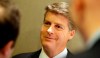 FILE - In this Nov. 18, 2015, file photo, New York Yankees owner Hal Steinbrenner smiles as he listens to a question while speaking with reporters at the baseball owners meeting in Dallas. Steinbrenner is pleased with the performance of his injury-decimated team. The Yankees have put 17 players on the injured list for 18 total stints. Still, they entered a three-game home series against AL East-leading Tampa Bay with a 26-16 record, a half-game behind the Rays.(AP Photo/LM Otero, File)