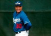FILE - In this Feb. 13, 2019, file photo, Los Angeles Dodgers manager Dave Roberts smiles during a spring training baseball workout in Glendale, Ariz. The Dodgers boast quality and depth in their pitching ranks. (AP Photo/Morry Gash, File)