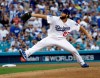 FILE - In this Oct. 28, 2018, file photo, Los Angeles Dodgers pitcher Clayton Kershaw winds up during the first inning in Game 5 of the World Series baseball game against the Boston Red Sox, in Los Angeles. Kershaw, one of the game's elite pitchers, anchors a deep rotation that is key to the team's continued success. (AP Photo/David J. Phillip, File)
