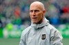 FILE - In this March 4, 2018, file photo Los Angeles head coach Bob Bradley walks across the pitch before an MLS soccer match against the Seattle Sounders in Seattle. Bradley was named MLS' Coach of the Year for the third time this week. (AP Photo/Ted S. Warren, File)