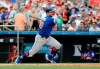 FILE - In this Feb. 28, 2019, file photo, New York Mets' Pete Alonso hits a single during the first inning of an exhibition spring training baseball game against the St. Louis Cardinals in Jupiter, Fla. Alonso is hitting .406 at spring training and leads the Mets with three home runs, yet he may start the season in the minor leagues. (AP Photo/Jeff Roberson, File)