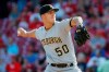 FILE - In this Sept. 29, 2018, file photo, Pittsburgh Pirates starting pitcher Jameson Taillon throws in the first inning of a baseball game against the Cincinnati Reds in Cincinnati. The Pirates put together just the franchise‚Äôs fourth winning season in the last quarter century, finishing 82-79 thanks in large part to the rapid development of a young starting rotation led by Jameson Taillon and Trevor Williams. (AP Photo/John Minchillo, File)