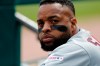 FILE - In this a Wednesday, April 10, 2019, Cleveland Indians' Carlos Santana watches from the dugout during the sixth inning of a baseball game against the Detroit Tigers in Detroit. The Indians first baseman was sworn in as a U.S. citizen on Friday, April 19, 2019, taking the 