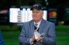 FILE - In this Oct. 16, 2016, file photo, Johnny Miller stands on the 18th green of the Silverado Resort North Course during the trophy presentation of the Safeway Open PGA golf tournament in Napa, Calif. Miller will climb into the booth at No. 18 for the final time on Saturday, calling the action for the third round of the Phoenix Open before hanging up his headset. The 71-year-old is walking away to spend more time with his family and picked the Phoenix Open for his finale because of his affinity for the tournament where he won twice and earned the nickname the 