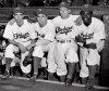FILE - In this April 15, 1947, file photo, from left, Brooklyn Dodgers baseball players John Jorgensen, Pee Wee Reese, Ed Stanky and Jackie Robinson pose at Ebbets Field in New York. Thursday, Jan. 31, 2017, marked the 100th anniversary of the birth of Jackie Robinson, who broke Major League Baseball‚Äôs color barrier, on April 15, 1947. AP Photo, File)