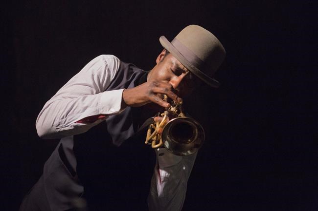 This image released by Abramorama shows Gary Carr portraying jazz pioneer Charles “Buddy” Bolden in a scene from