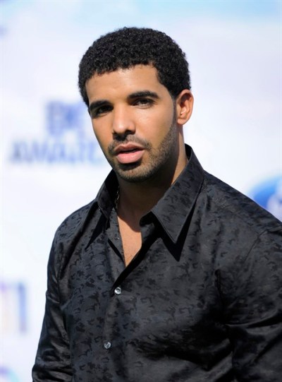 FILE - In this June 26, 2011 file photo, Drake arrives at the BET Awards in Los Angeles. A day after earning his high school diploma, an excited Drake performed hit songs for a few hundred people at an event for Tyra Banks. The 25-year-old told the crowd Thursday, Oct. 18, 2012, that he took a small break from music and 