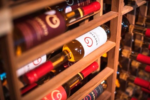 In this undated photo released by Route des Saveurs, a bottle of tomato-based wine waits to be sold at Omerto in Baie-Saint-Paul, Quebec in Canada. Omerto owner Pascal Miche took an idea from his grandfather and created the wine through years of trial and error. (Francis Gagnon/Route des Saveurs via AP)
