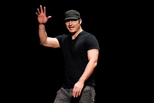 FILE - This April 26, 2018 file photo shows director Robert Rodriguez waving to the audience during the 20th Century Fox presentation at CinemaCon 2018 in Las Vegas. Cirque du Soleil is planning a new live show for the Las Vegas Strip this fall, written by Rodriguez. (Photo by Chris Pizzello/Invision/AP, File)