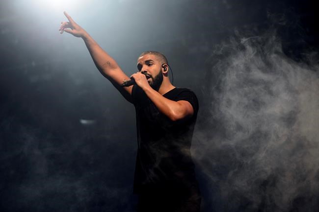 FILE - In this June 27, 2015 file photo, Canadian singer Drake performs on the main stage at Wireless festival in Finsbury Park, London. Drake's “Scorpion,” the highly anticipated, 25-track album by pop music’s No. 1 player, was released Friday. (Photo by Jonathan Short/Invision/AP, File)