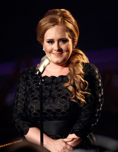 FILE - In this Aug. 28, 2011 file photo, singer Adele is shown at the MTV Video Music Awards in Los Angeles. Adele has canceled all tour dates and promotional appearances for the year and will undergo throat surgery. (AP Photo/Matt Sayles, file)