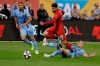 Toronto FC's Alejandro Pozuelo (10) fights for control of the ball with New York City FC's Alexander Ring, right, and Alexander Callens, left, during the first half of an MLS Eastern Conference soccer semifinal Wednesday, Oct. 23, 2019, in New York. (AP Photo/Frank Franklin II)