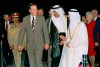 FILE - In this Nov. 21, 1990 file photo, President George H.W. Bush is greeted by King Fahd as he arrives in Saudi Arabia. At right is first lady Barbara Bush. At center is an interpreter. Bush died at the age of 94 on Friday, Nov. 30, 2018, about eight months after the death of his wife, Barbara Bush. (AP Photo/J. Scott Applewhite, File)