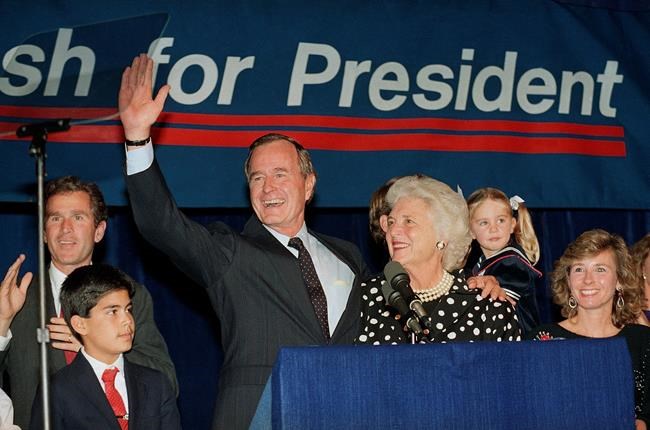 (AP Photo/Ed Kolenovsky, File)
FILE - In this Oct. 12, 1987, file photo, then-Vice President George H.W. Bush and his wife Barbara, with their son George W. Bush, far left, wave to supporters who turned out in Houston, to hear him announce he was a candidate for the Republican nomination for president of the United States.