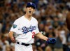 FILE - In this Oct. 26, 2018, file photo, Los Angeles Dodgers starting pitcher Walker Buehler celebrates after the last out in the top of the seventh inning in Game 3 of the World Series baseball game against the Boston Red Sox in Los Angeles. Buehler had good command of his pitches and plenty of life on his fastball in his long-awaited Cactus League debut Tuesday night, March 19, 2019. (AP Photo/Jae C. Hong, File)