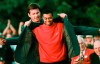 FILE - In this April 13, 1997, file photo, Masters champion Tiger Woods receives his Green Jacket from last year's winner Nick Faldo, rear, at the Augusta National Golf Club in Augusta, Ga. Woods completes an amazing journey by winning the 2019 Masters, overcoming 11 years of personal foibles and professional pain that seemed likely to be his lasting legacy. (AP Photo/Dave Martin, File)