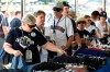 Gail Edmund of Northbound, Wash., left, purchases baseball souvenirs for friends before a Baseball Hall of Fame induction ceremony at the Clark Sports Center on Sunday, July 21, 2019, in Cooperstown, N.Y. (AP Photo/Hans Pennink)