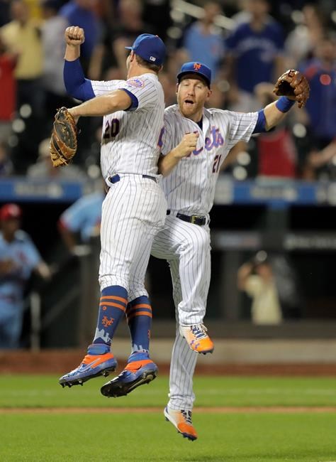 New York Mets first baseman Pete Alonso, left, and third baseman Todd Frazier celebrate after the Mets defeated the St. Louis Cardinals 8-7 during a baseball game Saturday, June 15, 2019, in New York. (AP Photo/Julio Cortez)