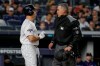 New York Yankees' Brett Gardner, left, talks with home plate umpire Manny Gonzalez after striking out against the Minnesota Twins during the first inning of Game 1 of an American League Division Series baseball game, Friday, Oct. 4, 2019, in New York. (AP Photo/Seth Wenig)