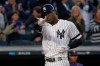 New York Yankees' Didi Gregorius motions as he crosses the plate after hitting a grand slam home run against the Minnesota Twins during the third inning of Game 2 of an American League Division Series baseball game, Saturday, Oct. 5, 2019, in New York. (AP Photo/Seth Wenig)