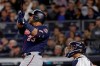 Minnesota Twins designated hitter Nelson Cruz (23) connects for a solo home run against the New York Yankees during the third inning of Game 1 of an American League Division Series baseball game, Friday, Oct. 4, 2019, in New York. (AP Photo/Frank Franklin II)