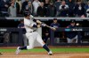 New York Yankees' DJ LeMahieu connects for a three-run double to left field against the Minnesota Twins during the seventh inning of Game 1 of an American League Division Series baseball game, Friday, Oct. 4, 2019, in New York. (AP Photo/Seth Wenig)