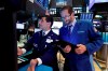 FILE - In this May 28, 2019, file photo specialist Peter Mazza, left, and trader Stephen Gilmartin work on the floor of the New York Stock Exchange. The U.S. stock market opens at 9:30 a.m. EDT on Friday, May 31. (AP Photo/Richard Drew, File)
