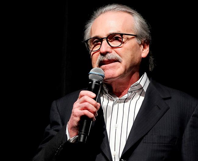 FILE - In this Jan. 31, 2014 photo, David Pecker, Chairman and CEO of American Media, addresses those attending the Shape & Men's Fitness Super Bowl Party in New York. An attorney for the head of the National Enquirer’s parent company says the tabloid didn’t commit extortion or blackmail by threatening to publish Amazon CEO Jeff Bezos’ explicit photos. Elkan Abramowitz represents American Media Inc. CEO David Pecker. He defended the tabloid’s practice as a “negotiation” in an interview Sunday, Feb. 10, 2019, with ABC News. (Marion Curtis via AP, File)