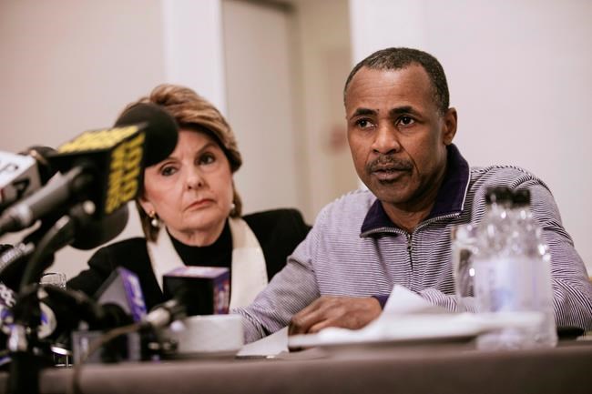 Gary Dennis, seated with Lawyer Gloria Allred, speaks during a press conference announcing a video tape said to present further evidence of wrongdoing by recording artist R. Kelly Sunday, March 10, 2019, in New York. Dennis said the tape, which he found at his home in Pennsylvania, shows R. Kelly sexually abusing more than one underage girl. (AP Photo/Kevin Hagen)