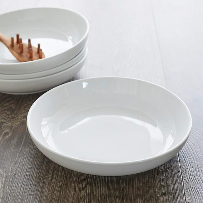 This photo provided by Sur La Table shows Peter Kayaian's sturdy porcelain bowl plate hybrid from Sur La Table.