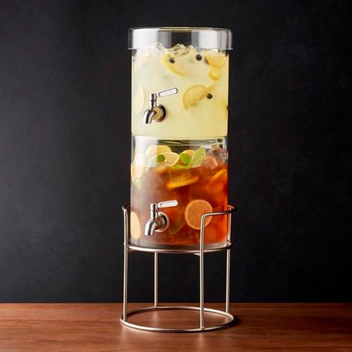 This photo provided by Crate & Barrel shows a stacking drink dispenser with a silver stand. An item like this available at Crate & Barrel can lend a hand in entertaining in a small space. With a little planning, even the smallest homes can be just right for holiday entertaining. (Crate & Barrel via AP)