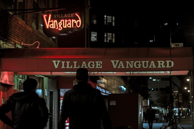 This undated photo provided by the Village Vanguard shows people walking by the jazz club in New York. The historic jazz venue has been in the same location, down 15 steps at 178 Seventh Avenue South in Manhattan, since 1935. Legend has it that it's the oldest Jazz club in the world. New York has long been a city known for jazz. What's less known is how kid- and family-friendly jazz performances can be. (Michael Larson/Village Vanguard via AP)