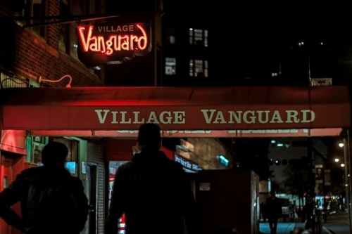 This undated photo provided by the Village Vanguard shows people walking by the jazz club in New York. The historic jazz venue has been in the same location, down 15 steps at 178 Seventh Avenue South in Manhattan, since 1935. Legend has it that it's the oldest Jazz club in the world. New York has long been a city known for jazz. What's less known is how kid- and family-friendly jazz performances can be. (Michael Larson/Village Vanguard via AP)