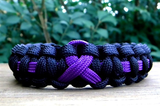 A Purple Awareness Ribbon Paracord Bracelet created by Melissa Duke is shown in Pleasant View, T.N. Duke, who last summer learned how to craft with nylon parachute cord, has sold about 1,000 bracelets through various online sites, including her Etsy.com store, Knot Creations. (AP Photo/Melissa Duke)