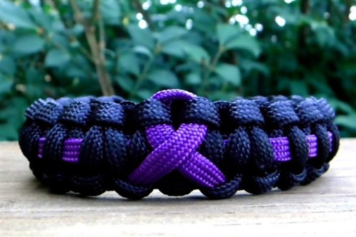 A Purple Awareness Ribbon Paracord Bracelet created by Melissa Duke is shown in Pleasant View, T.N. Duke, who last summer learned how to craft with nylon parachute cord, has sold about 1,000 bracelets through various online sites, including her Etsy.com store, Knot Creations. (AP Photo/Melissa Duke)
