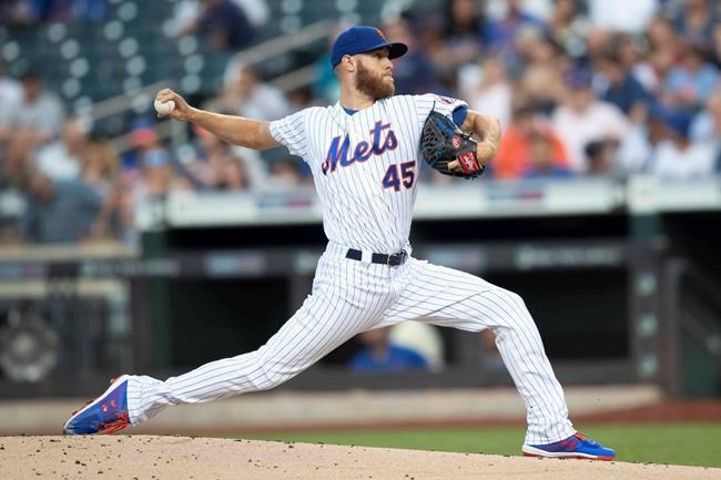 New York Mets starting pitcher Zack Wheeler delivers during the first inning of the team's baseball game against the Miami Marlins, Tuesday, Aug. 6, 2019, in New York. (AP Photo/Mary Altaffer)