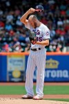 New York Mets starting pitcher Zack Wheeler pauses before throwing during the first inning of a baseball game against the Philadelphia Phillies at Citi Field, Sunday, July 7, 2019, in New York. (AP Photo/Seth Wenig)