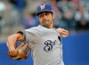 Milwaukee Brewers starting pitcher Gio Gonzalez throws during the first inning of the MLB baseball game against the New York Mets at Citi Field, Sunday, April 28, 2019, in New York. (AP Photo/Seth Wenig)