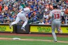 Washington Nationals' Bob Henley (13) watches as New York Mets starting pitcher Jacob deGrom loses control of the ball on a throwing error by first baseman Pete Alonso during the first inning of a baseball game Sunday, Aug. 11, 2019, in New York. Three runs scored on the play. (AP Photo/Frank Franklin II)