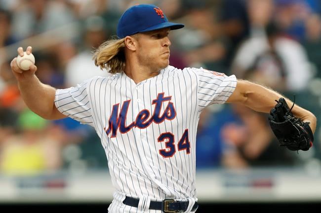 New York Mets starting pitcher Noah Syndergaard winds up during the first inning of a baseball game against the Atlanta Braves, Sunday, June 30, 2019, in New York. (AP Photo/Kathy Willens)