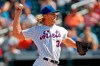 New York Mets starting pitcher Noah Syndergaard (34) winds up during the first inning of a baseball game against the Philadelphia Phillies, Sunday, Sept. 8, 2019, in New York. (AP Photo/Kathy Willens)