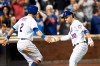 New York Mets' Michael Conforto (30) celebrates hitting a home run with Joe Panik (2) during the sixth inning of a baseball game against the Cleveland Indians, Tuesday, Aug. 20, 2019, in New York. (AP Photo/Mary Altaffer)