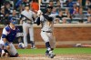 New York Yankees' Didi Gregorius watches his solo home run next to New York Mets catcher Wilson Ramos during the sixth inning of a baseball game Wednesday, July 3, 2019, in New York. (AP Photo/Kathy Willens)