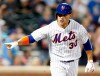 New York Mets' Michael Conforto gestures toward the dugout as he runs down the first base line after hitting a two-run double during the eighth inning of an interleague baseball game against the New York Yankees, Tuesday, July 2, 2019, in New York. (AP Photo/Kathy Willens)