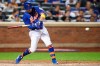 New York Mets' J.D. Davis hits a single during the fifth inning of a baseball game against the Philadelphia Phillies, Saturday, Sept. 7, 2019, in New York. (AP Photo/Mary Altaffer)